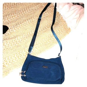 A blue Baggallini cross body bag